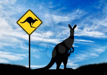 Silhouette of a kangaroo with a baby and a road sign on the sky background