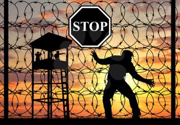 Concept of refugee. Silhouette of illegally crossing graeitsu refugee and viewing tower
