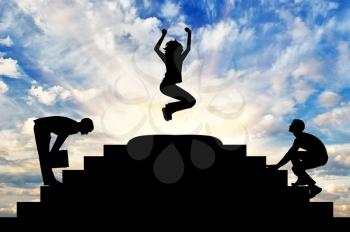 Concept of business success. Silhouette of a happy business woman in a jump at the top of the steps and the competition