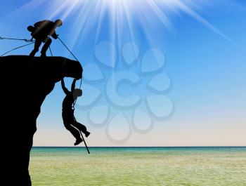 Concept of aid. Silhouette of two climbers help each other