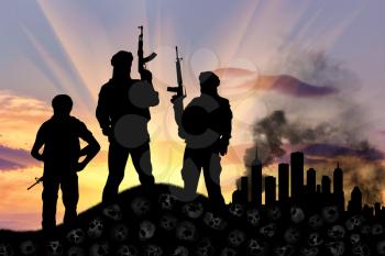 Concept of a terrorist attack. Silhouette of terrorists with a rifle standing on a pile of skulls on the background of the city in smoke