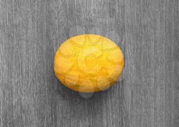Ripe juicy melons on a wooden background texture. View from above