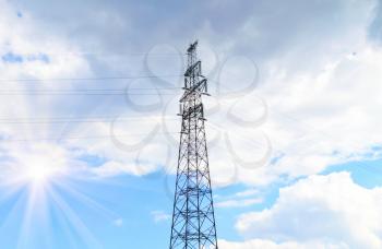 Large electric tower on a background of the cloudy sky