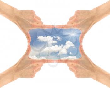 Concept of ecology and environment. Cloudy sunny sky in the frame of four hands