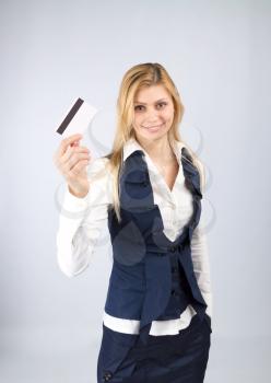 Shopping concept. Smiling business woman holding a bank card