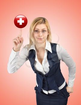  Concept of health and medicine. Business woman holding a red cross symbol