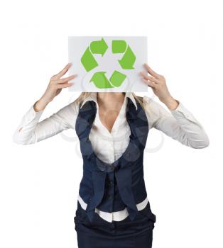 Ecology concept. A woman shows a banner with the symbol of recycling