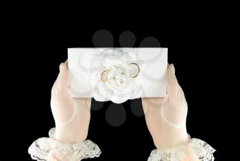 concept of wedding accessories. Women's hands are holding a box with wedding rings