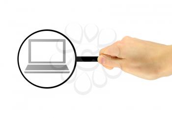 Computer security concept. Man's hand with a magnifying glass examines computer