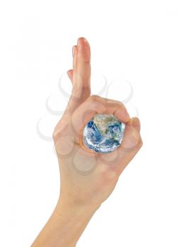 Concept of globalization. The gesture hands ok and the planet earth in the center. Isolated on white background NASA