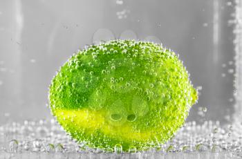 Lime Citrus in water. design element