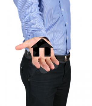 Real estate concept. Business man holding a house icon