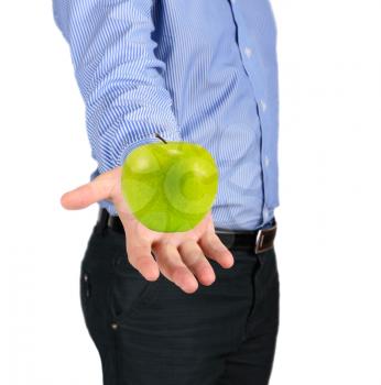 Healthy food concept. Green apple in a man's hand