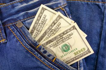 Business and finance concept. Money dollars in the pocket of jeans trousers
