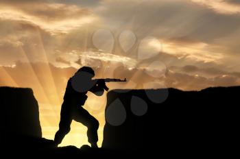 Military soldier with weapon in trenches against sky. concept of conflict and war