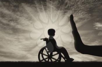 disabled child in a wheelchair and a gesture of the hand stop.