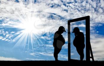 Fat boy and his reflection in the mirror of a normal boy against the sky. Obesity concept