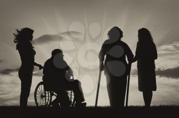 Disabled persons in wheelchair and crutches and nurses on background of sky. Concept of disability