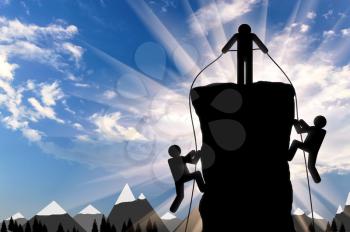 Climber helps ascent of two climbers on a mountain top. Concept of teamwork and trust