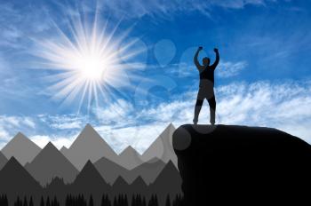 Silhouette happy climber on a mountain top. success Concept