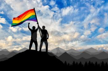 Silhouette of a gay couple with rainbow flag at the top. Concept gay rights