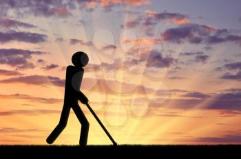 Blind invalid walks with a cane in his hands. Concept of disability