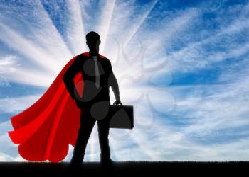Superman is a businessman superhero. Silhouette of a confident and strong superman businessman with a briefcase at dawn
