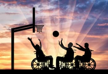 Three disabled to play wheelchair basketball. The concept of sports lifestyle people with disabilities