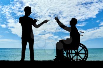 Happy disabled person in a wheelchair on the background of the sea and a friend who supports it. The concept of support for people with disabilities