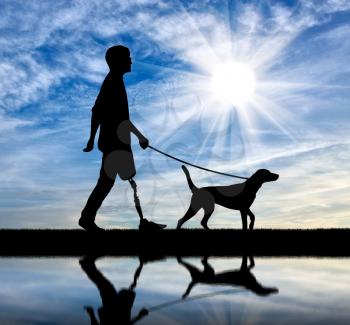 Disability and rehabilitation. Disabled man with prosthetic leg walks with my dog at the river