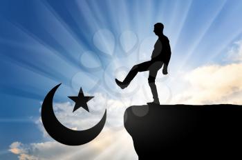 Man atheist pushes symbol of islam into cliff. Concept of atheism