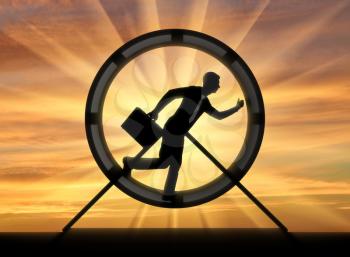 The notion of running like a hamster in a wheel. Silhouette running and hardworking businessman in a hamster wheel