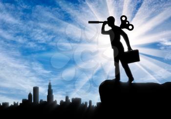 The concept of the motivated worker. Silhouette of a worker with a clockwork mechanism in the back and looks through a telescope in search of new opportunities