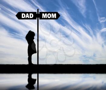 Divorce in the family. Silhouette of a sad baby girl crying near the signpost road, choosing dad or mom. The concept of divorce and division of children