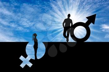 The silhouette of a superior man over a woman who stands in a pit out of a gender symbol. The concept of gender inequality and discrimination