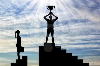 Silhouette of a male winner with a trophy on the career ladder against the background of a woman who has no chance of winning. The concept of gender inequality and discrimination