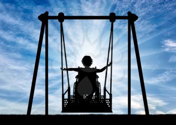 Lifestyle of children with disabilities. Happy child is disabled in a wheelchair on an adaptive swing for disabled children.
