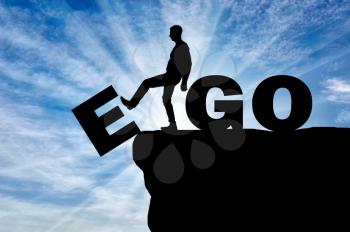 Conceptual image of the fight against egoism. Silhouette of a man gets rid of the ego as a bad habit.