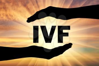 Extracorporal fertilization. Word IVF in the hands. Conceptual image of in vitro fertilization