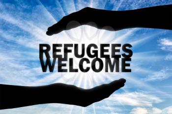 Refugees welcome, words are in the hands of a man. Concept, Europe is ready to help and accept refugees