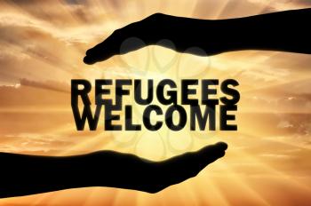 Refugees are welcome, words are in the hands of a man. Concept, Europe is ready to help and accept refugees