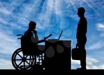 Silhouette of a man a businessman disabled in a wheelchair sitting at a table holds an interview with a man about hiring to work. The concept of working disabled people