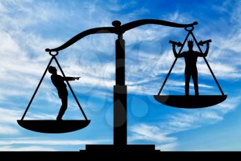 Silhouette of an ordinary man on scales of justice, he is in priority and he laughs at a selfish man with a crown on his head. The concept of egoism as a problem in a normal society