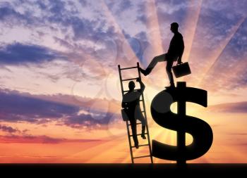 Silhouette of a businessman climbs the stairs, and another businessman standing on a dollar symbol pushes this ladder. The concept of greed and inequality