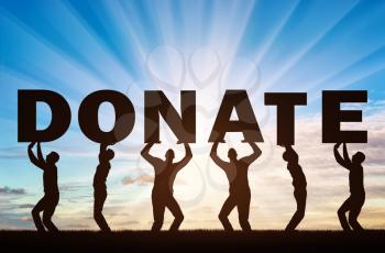 Altruism concept. Group of men holds the letters Donate.