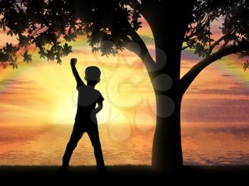 Happy childhood concept. Silhouette of a happy child under the oak tree against sea sunset and rainbow