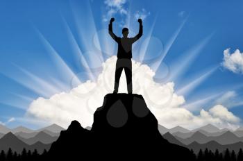 Silhouette of a happy climber on top of a mountain which he conquered. Conceptual scene of success