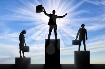Concept hiring process. Silhouette of the jubilant man who received the position, stands on the podium of the winner higher than the silhouette of an upset man and woman - nearby