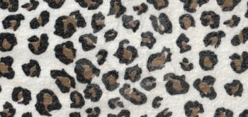 The texture of the wool fabric with a leopard print.