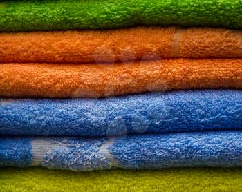 Background with bright pure colored Terry towels.